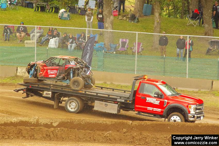 Robin Shute's Can-Am Maverick X3 is hauled away, done for the weekend.