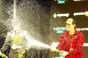 Travis Pastrana and Brian Deegan spray the crowd at victory lane.