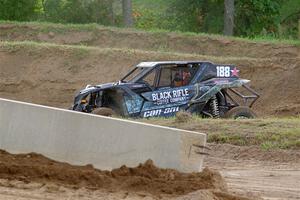 Terry Madden's Can-Am Maverick X3 snaps the front suspension and limps off the track.