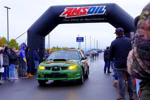 Dave Carapetyan / K.J. Miller Subaru WRX STi leaves the ceremonial start.