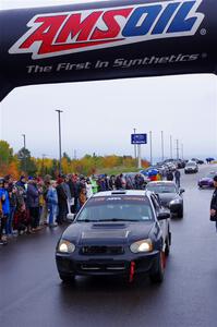 Dylan Murcott / Andrew Sims Subaru WRX STi leaves the ceremonial start.