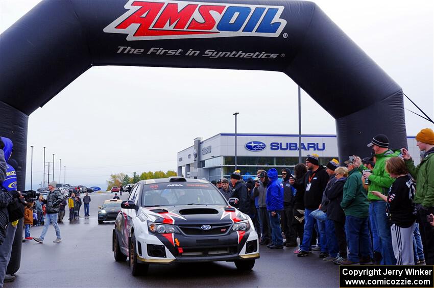 Grzegorz Bugaj / Ela Dziubanski Subaru WRX STi leaves the ceremonial start.