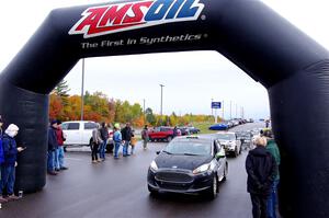 Paul Dickinson / Dylan Whittaker Ford Fiesta leaves the ceremonial start.