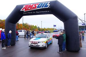 Sam Jacques / Trevor Lacombe Subaru Impreza leaves the ceremonial start.