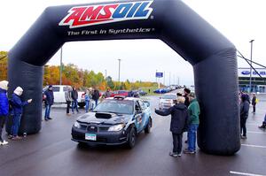 Matt James / Jackie James Subaru Impreza leaves the ceremonial start.