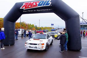 Richard Donovan / Greg Donovan Subaru Impreza leaves the ceremonial start.