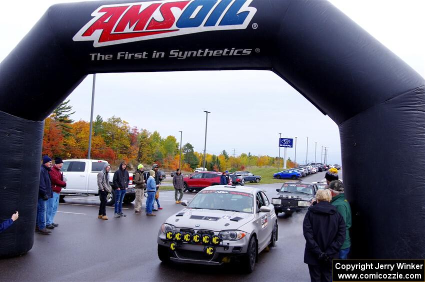 Mike Cadwell / Jimmy Veatch BMW 135i leaves the ceremonial start.