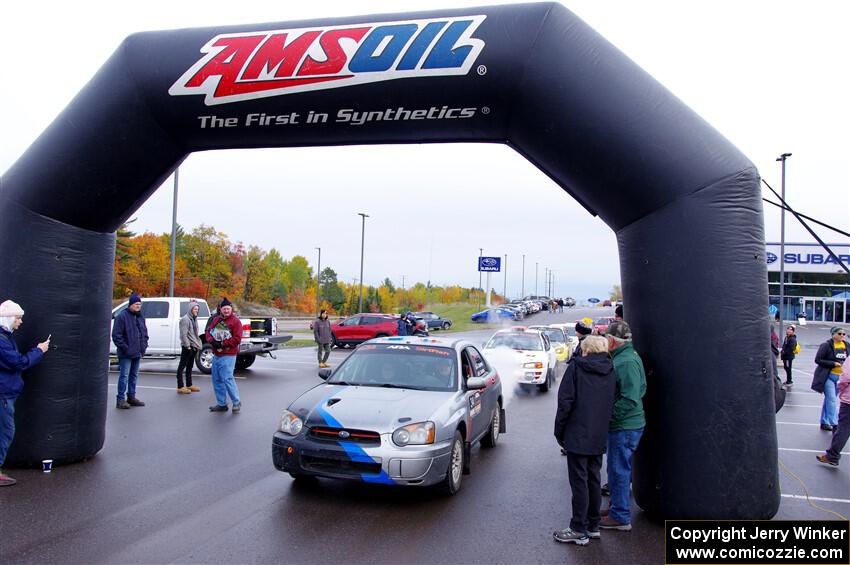 Andrew Dustman / Rachel Dustman Subaru Impreza leaves the ceremonial start.