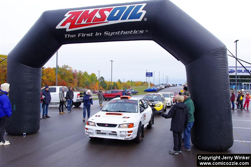 Richard Donovan / Greg Donovan Subaru Impreza leaves the ceremonial start.