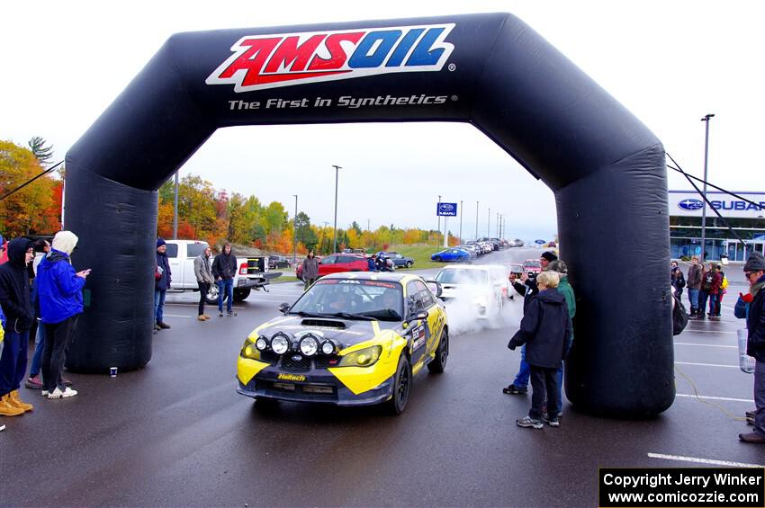 Colin Schulz / Jake Carlson Subaru WRX STi leaves the ceremonial start.