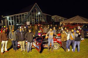 Former crew and co-drivers pose with the Al Dantes, Jr. Mazda RX-7 LS.