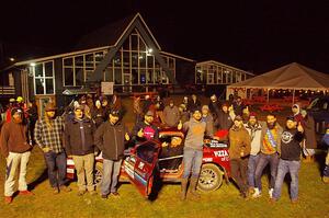 Former crew and co-drivers pose with the Al Dantes, Jr. Mazda RX-7 LS.