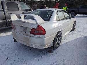 A worker drove a Mitsubishi Lancer Evo IV up to the event.