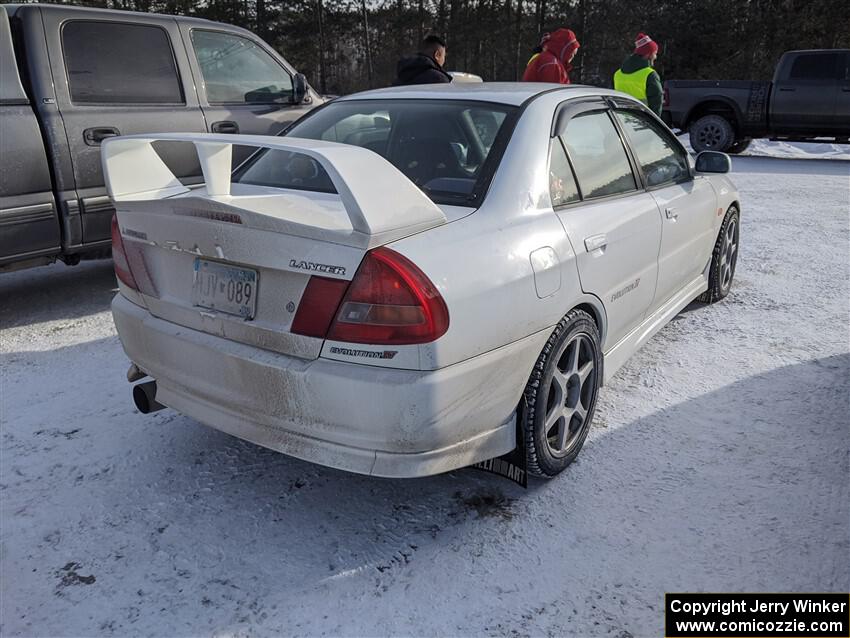 A worker drove a Mitsubishi Lancer Evo IV up to the event.