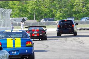 Keith Anderson's SPO Dodge Viper and John Glowaski's ITA Chrysler Neon ACR head for the track exit.