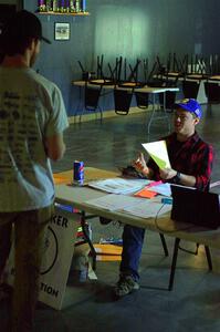 Tyler Linner checks in a worker at workers registration.