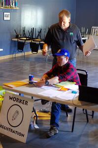 Tyler Linner and Mark Larson at workers registration.