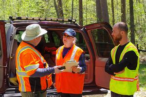 A start control crew gets ready for the stage.