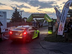 Tim Rooney / Mike Rossey Subaru WRX STi rolls up to the start line for Thursday night's ceremonial start.