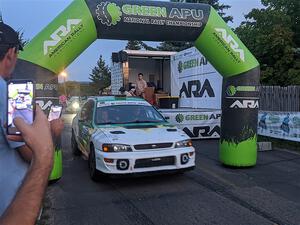Ryan Rethy / James Dallman Subaru Impreza Wagon leaves the start line for Thursday night's ceremonial start.