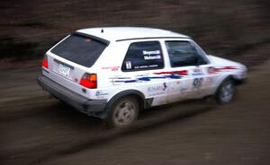 Bob Nielsen / Kathy Freund drift through a sweeper on SS1 at speed in their VW GTI.