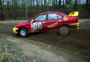 Dennis Martin / Kim DeMotte drift their Mitsubishi Lancer Evo IV through a 90-left on SS2.