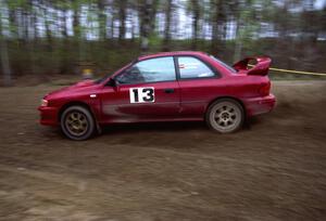 Piotr Wiktorczyk / Ray Summers power out of a 90-left on SS2 in their Subaru Impreza.