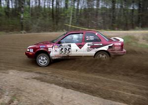 Jake Himes / Silas Himes drift through a 90-left on SS2 in their Nissan Sentra SE-R.