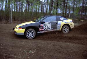 Eric Olson	 / Adam Skoog drift their Eagle Talon through a 90-left on SS2.