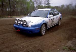 Micah Wiitala / Jason Takkunen drift through a 90-left on SS2 in their Saturn SL2.