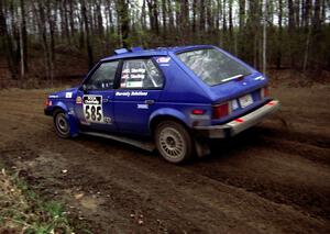 Dave Sterling / Stacy Sterling drift their Dodge Omni GLH-S through a 90-left on SS2.