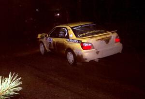 Steve Gingras / Phil Strohm at speed in their Subaru WRX at night.