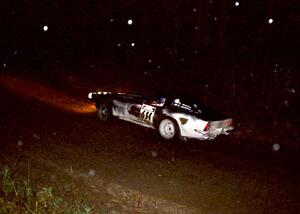 Doug Jenkins / Kerry Jenkins drive through a fast-sweeping right in their Chevy Corvette at night.