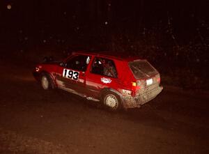 The Karl Biewald / Ted Weidman VW GTI at speed at night near the end of the event.
