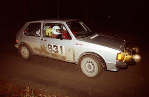 Chris Wilke / Mike Wren at speed down a straight at night in their VW Rabbit.