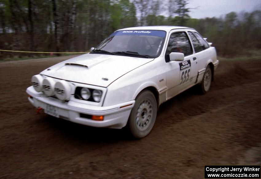 Colin McCleery / Nancy McCleery drift through a 90-left on SS2 in their Merkur XR4Ti.