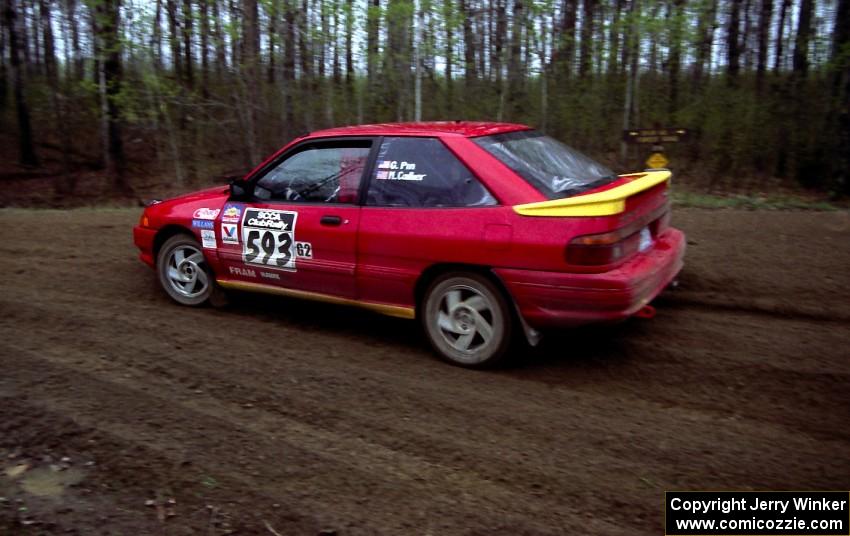 Gerardo Pin / Mike Callier come out of a 90-left on SS2 in their Ford Escort GT.