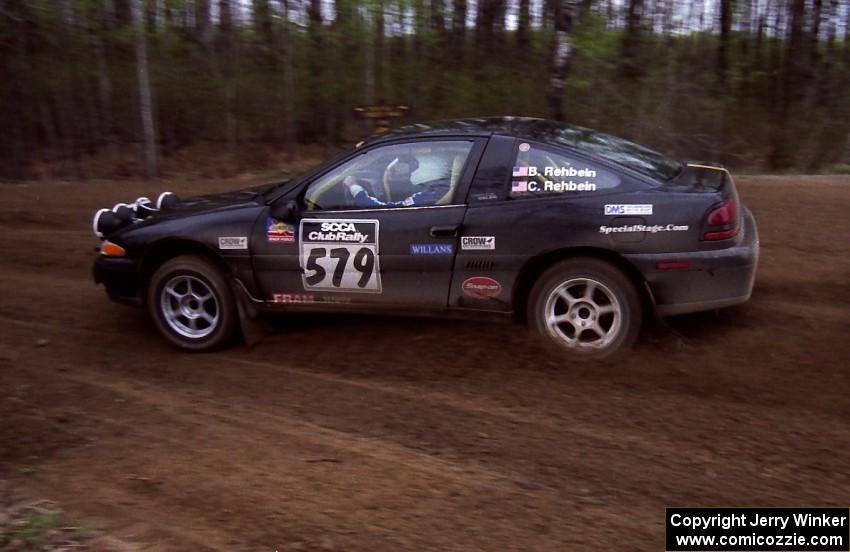 Brian Rehbein / Crystal Rehbein drift their Plymouth Laser through a 90-left on SS2.