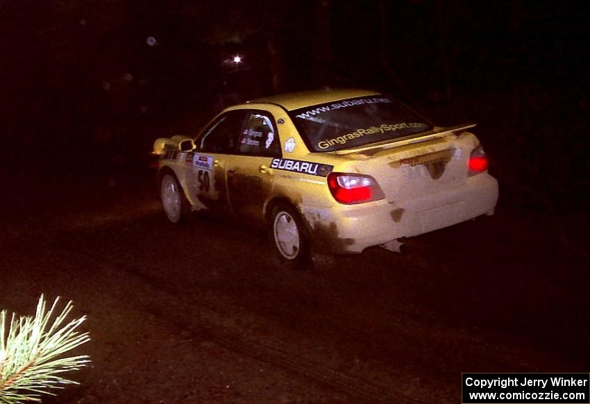 Steve Gingras / Phil Strohm at speed in their Subaru WRX at night.