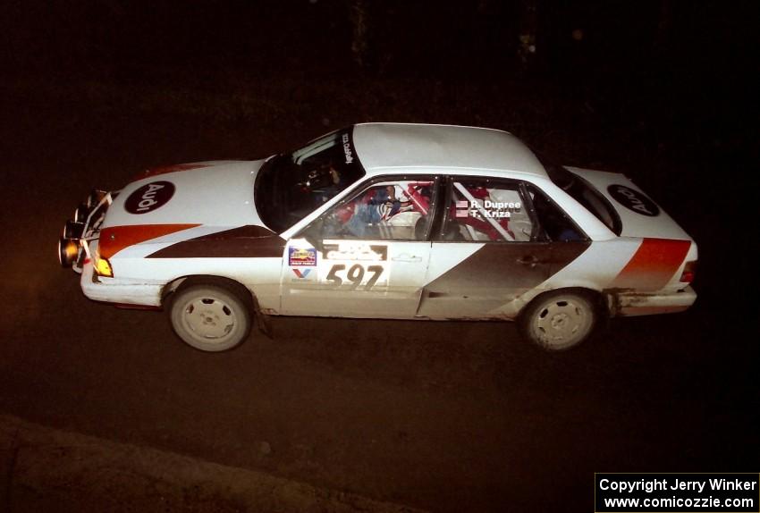 Rob Dupree / Travis Kriza at speed in their Audi 100 Quattro at night.