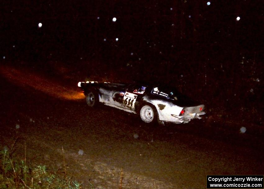 Doug Jenkins / Kerry Jenkins drive through a fast-sweeping right in their Chevy Corvette at night.