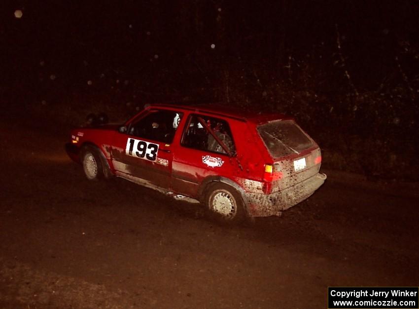 The Karl Biewald / Ted Weidman VW GTI at speed at night near the end of the event.