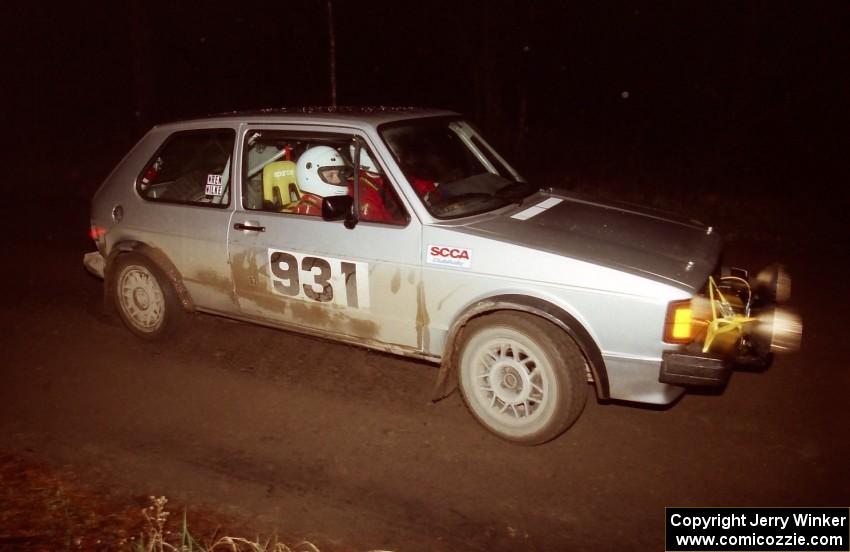 Chris Wilke / Mike Wren at speed down a straight at night in their VW Rabbit.