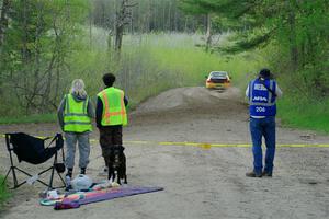 Marshals watch Steve Gingras / Katie Gingras Subaru Impreza on SS5, Blue Trail II.