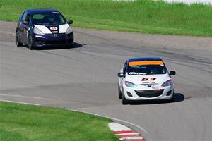 Bill Collins' B-Spec Mazda 2 and Andrew Janssen's B-Spec Honda Fit