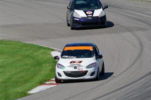 Bill Collins' B-Spec Mazda 2 and Andrew Janssen's B-Spec Honda Fit
