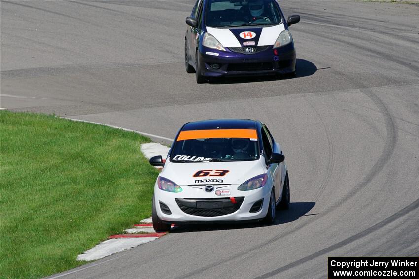 Bill Collins' B-Spec Mazda 2 and Andrew Janssen's B-Spec Honda Fit