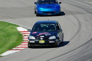 Tom Daly's T4 VW Rabbit and Rick Buan's Spec Miata Mazda Miata