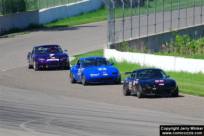 Cody Lindman's STL Mazda Miata, George Ellis' Spec Miata Mazda Miata and Geoff Youngdahl's Spec Miata Mazda Miata