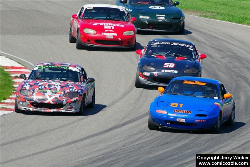 Gordon Kuhnley's, Cohen Craft's, Austin Pearce's, Andrew Jenkins' and Sam Nogosek's Spec Miata Mazdas